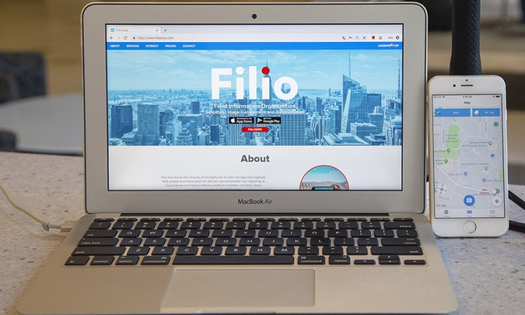 A laptop computer and iPhone show the Filio web app and mobile app, respectively. (Photo: Amelia Neumeister)