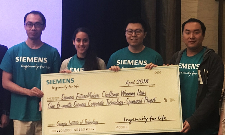 Civil engineering students Yang Jiang, Emily Sanders and Heng Chi plus computation science and engineering student Yuyu Zhang with their first-place check after the Siemens FutureMakers Challlenge. Their concept for the hackathon at Georgia Tech combined machine learning and topology optimization to make computational design and digital manufacturing more efficient and effective. (Photo Courtesy: Glaucio Paulino)