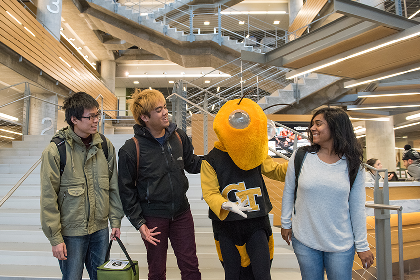 Students gathered around mascot