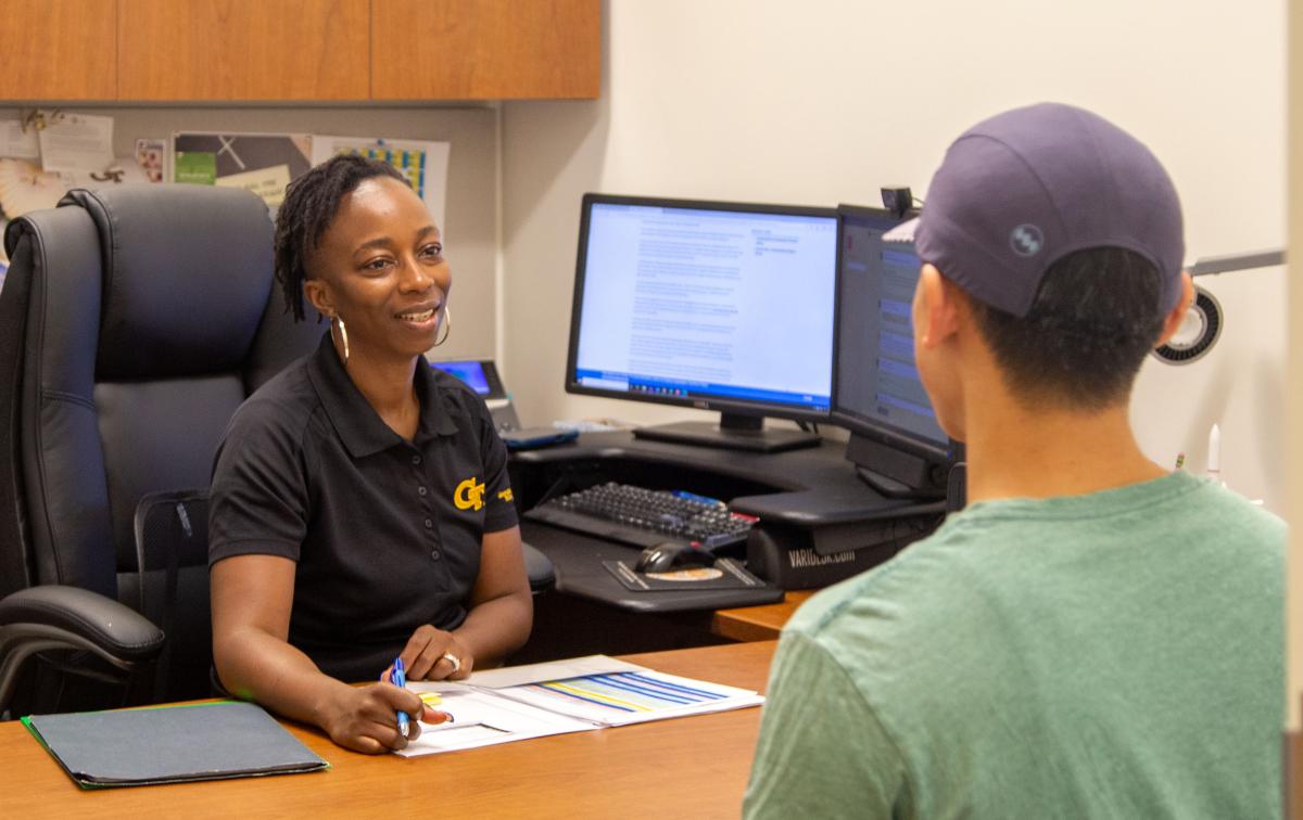 Advisor working with a student