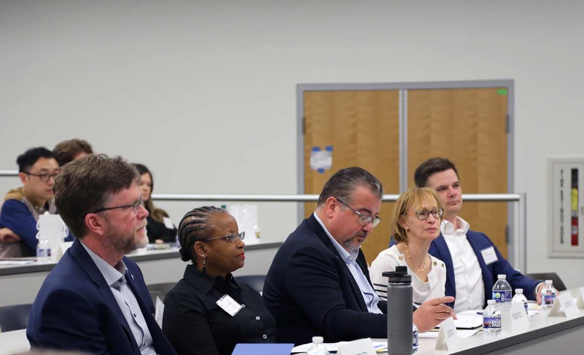 Five judges look on at a presentation for the 2024 EIC competition