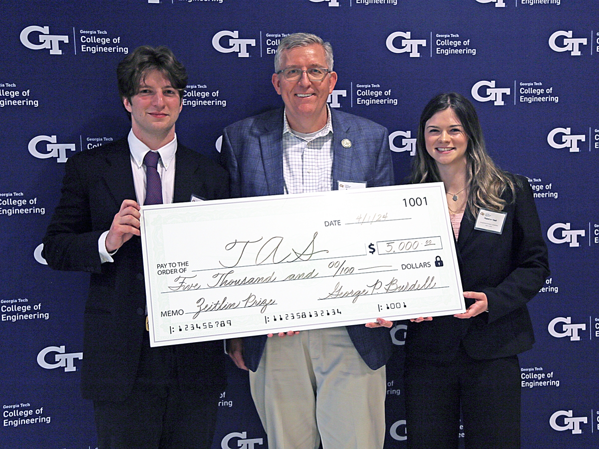 Zeitin Award winning team TAS with department chair Don Webster holding big check