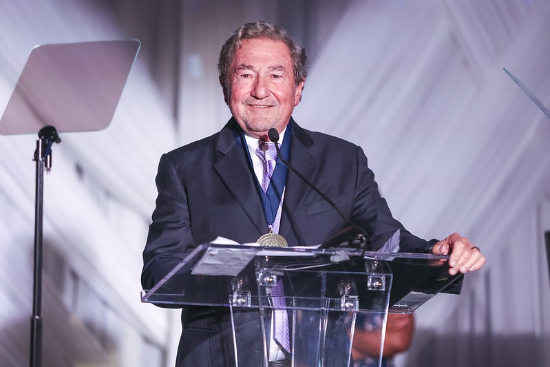 A smiling man at a podium