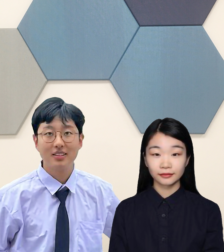 two people in front of blue hexagon tiles