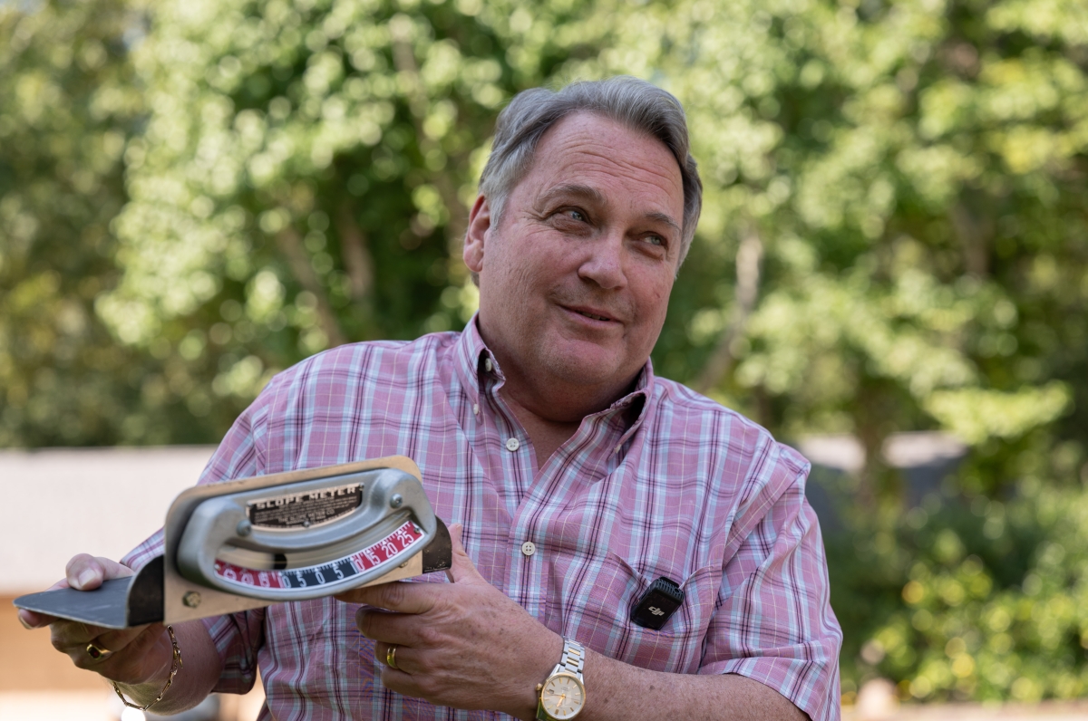 Tim Allen holds a ball bank indicator 