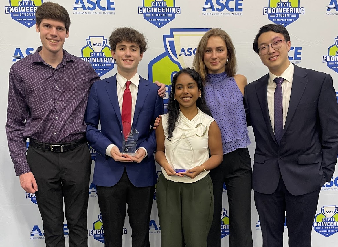 Group of five GT-ASCE students pose in front of conference background with their 2nd-place trophy