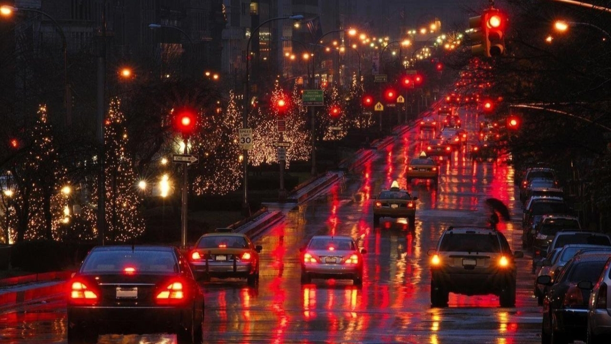 Cars driving on a wet road at night