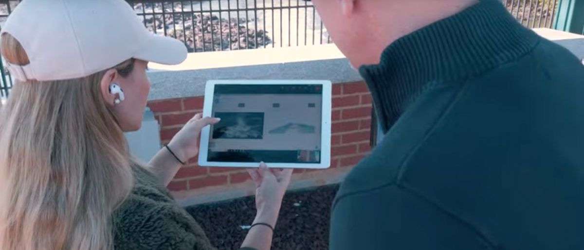Two people looking at an ipad
