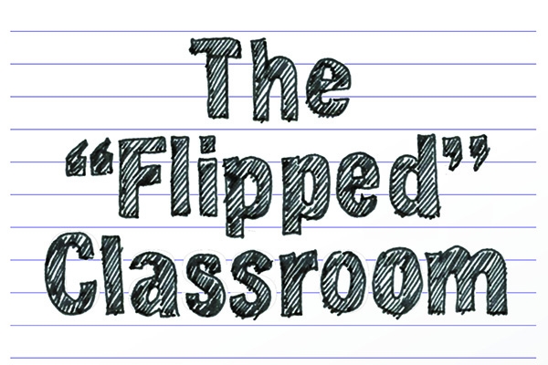 The "flipped" classroom - drawing of an upside down school desk on a piece of notebook paper.