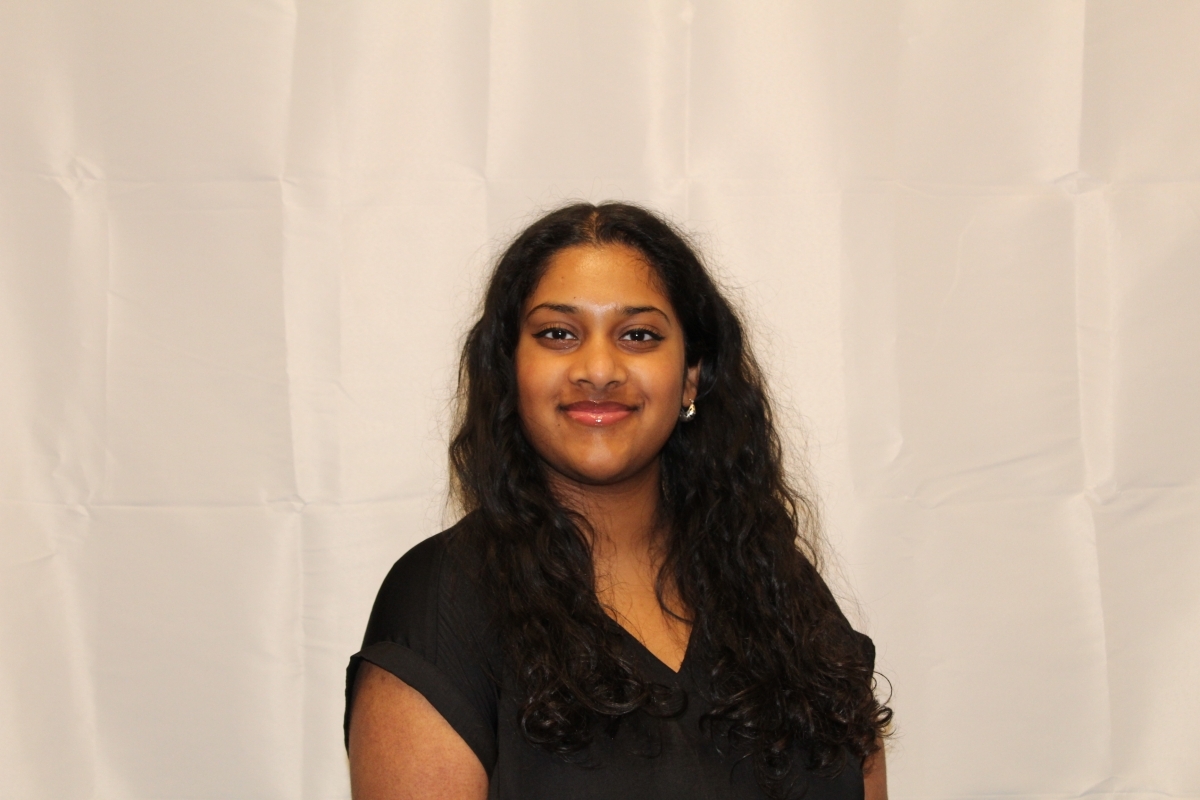 Portrait of Shreya Jayaram in a black blouse