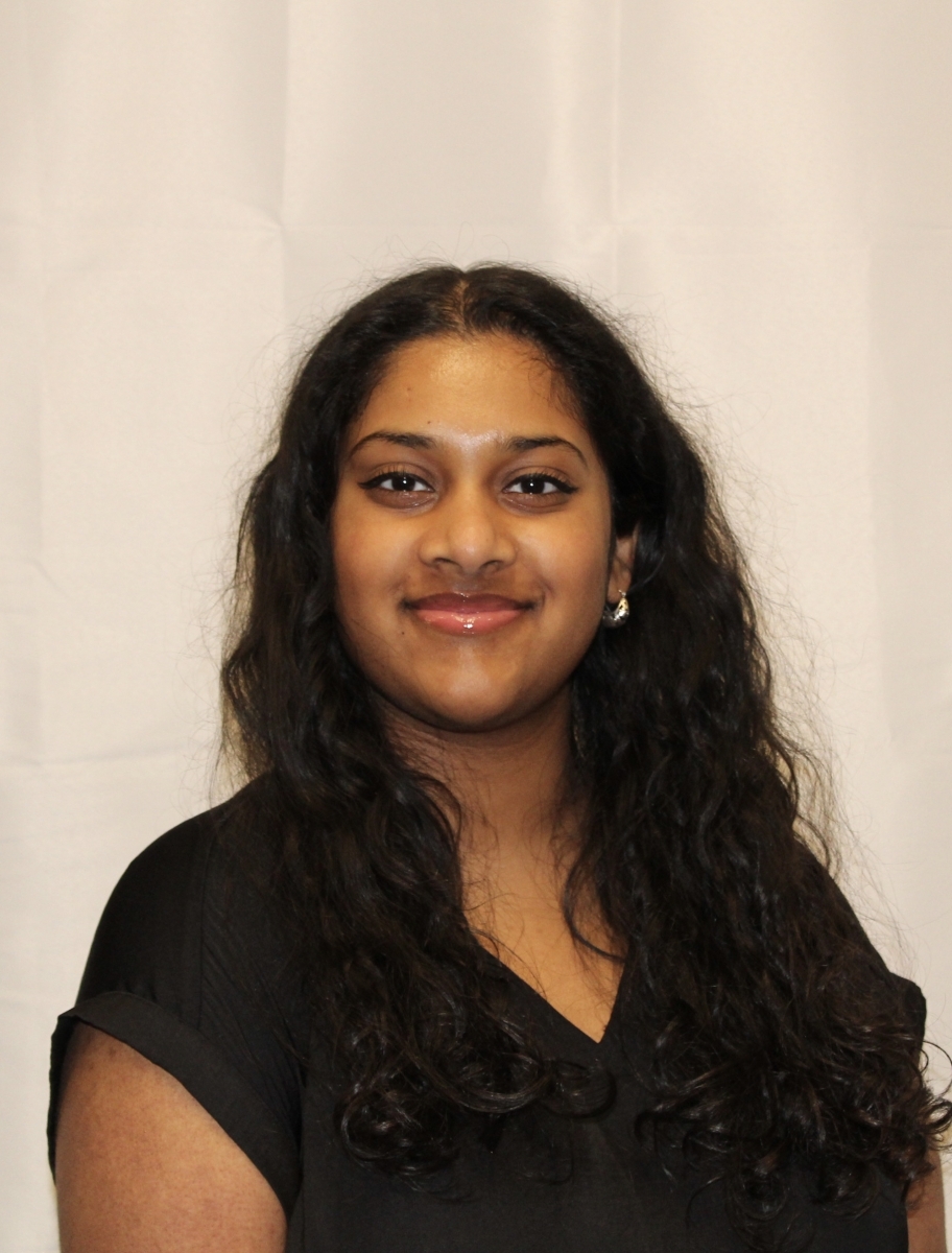 Portrait of Shreya Jayaram in a black blouse