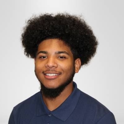 Portrait of Jonathan Rankine wearing a blue polo shirt