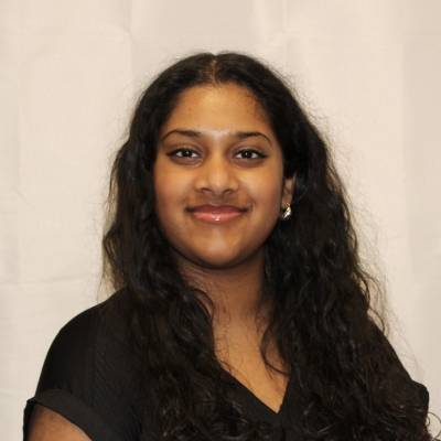 Portrait of Shreya Jayaram in a black blouse